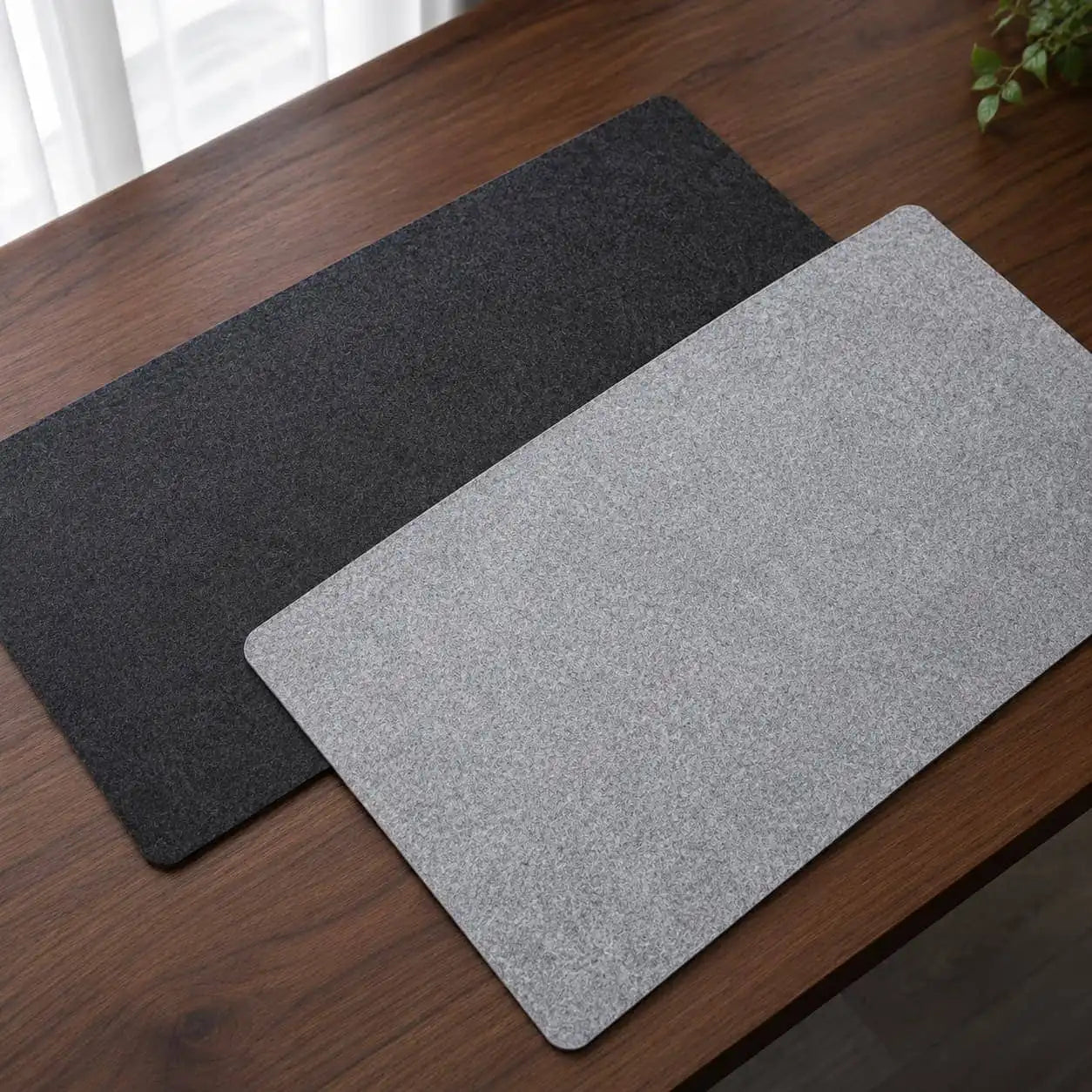 Aovela felt and cork double-sided desk mat on a warm wood home-office desk